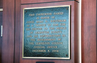 Photo of Judge Westbrook Courtroom dedication plaque